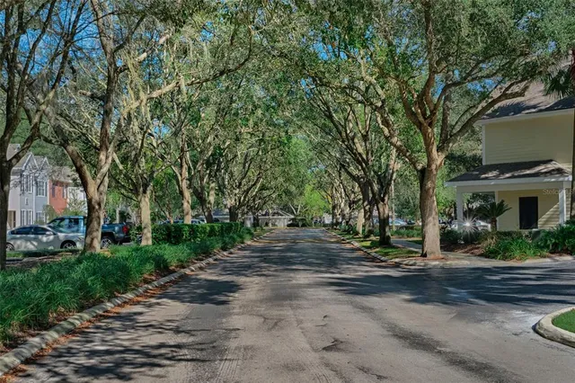 a view of a street with houses on both side