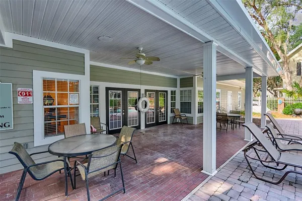 a view of a house with patio and wooden floor