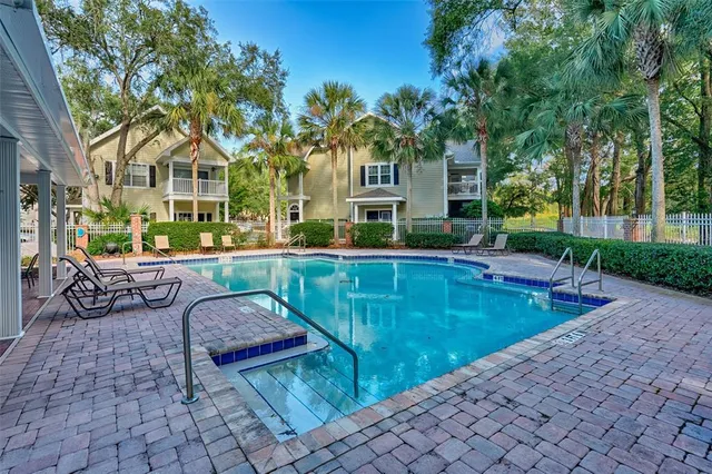 a view of a swimming pool with a patio