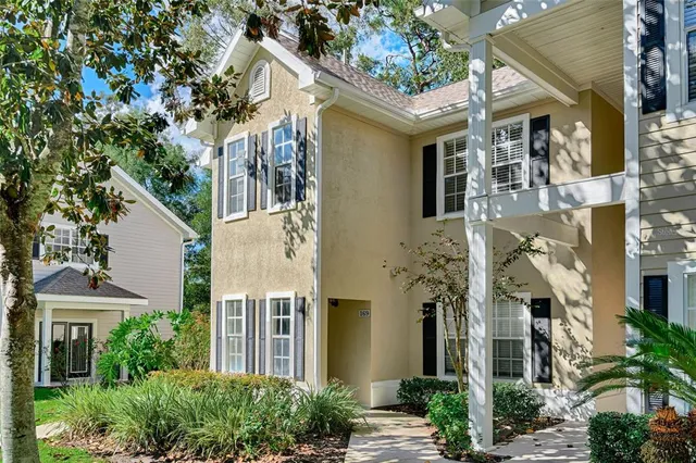 front view of a house with a tree