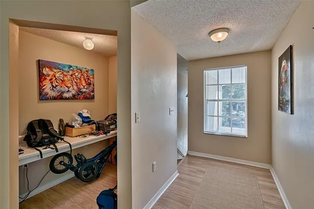 a view of room with workspace and window