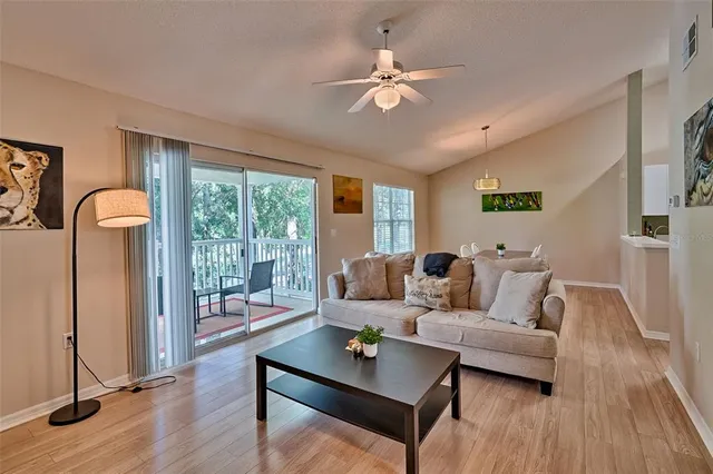 a living room with furniture and a large window