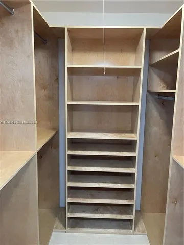 a view of a floor to ceiling window and an empty room