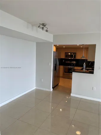 a kitchen view with stainless steel appliances a stove and cabinets