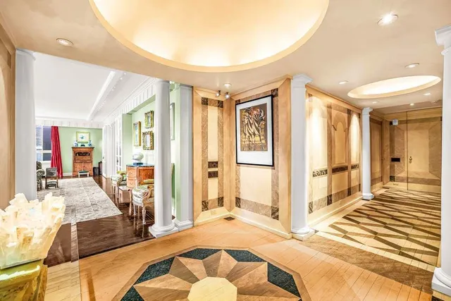 a spacious bedroom with a bed and glass door