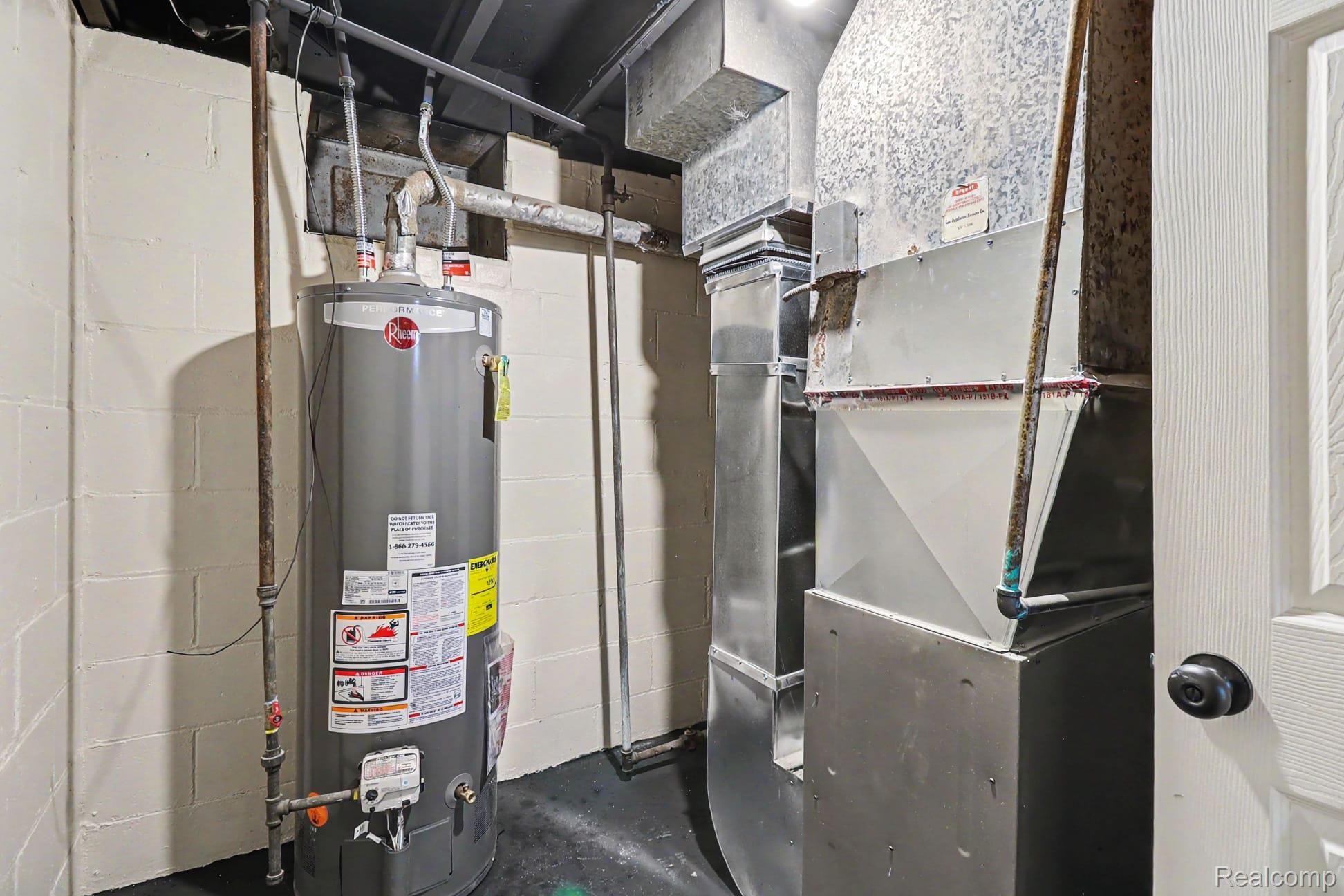 16682 Robson Street Detroit, MI 48235 - Photo 19 of 19 Utility area featuring a water heater and ductwork