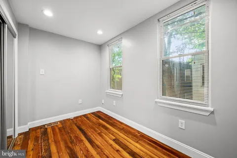 a view of a bedroom with washer and dryer