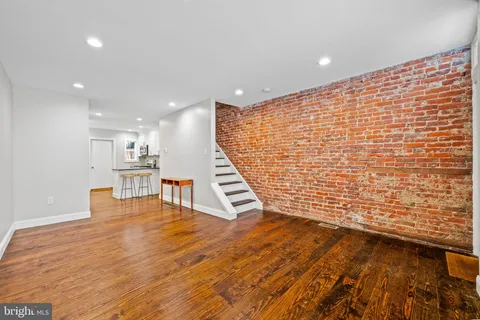 a view of kitchen with wooden floor