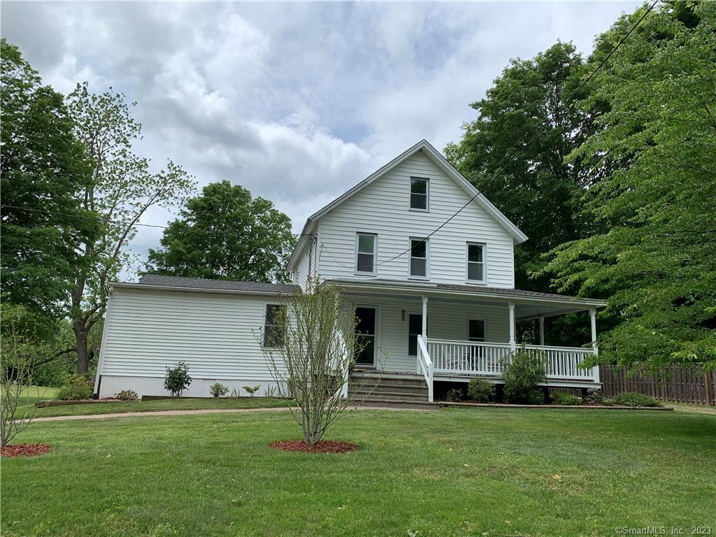 22 West Morris Road Litchfield, CT 06750 - Photo 1 of 1 a front view of house with a garden