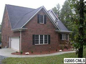 7301 Nesbit Road Waxhaw, NC 28173 - Photo 4 of 8 a front view of a house with a yard