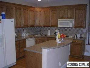 7301 Nesbit Road Waxhaw, NC 28173 - Photo 5 of 8 a kitchen with a sink and cabinets