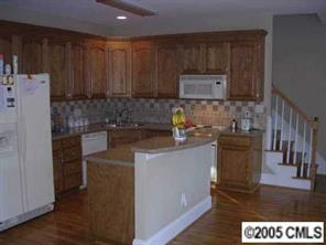 7301 Nesbit Road Waxhaw, NC 28173 - Photo 6 of 8 a kitchen with a sink and a stove top oven