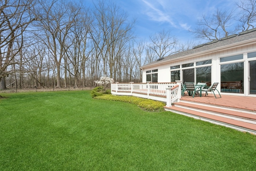 48 Meadowview Road Northfield, IL 60093 - Photo 16 of 42 a view of a house with a backyard porch and sitting area