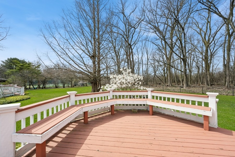 48 Meadowview Road Northfield, IL 60093 - Photo 18 of 42 a view of a balcony with wooden fence and trees