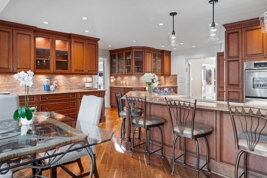 48 Meadowview Road Northfield, IL 60093 - Photo 22 of 42 a dining room filled chandelier and wooden floor
