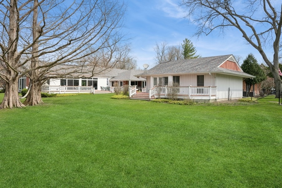 48 Meadowview Road Northfield, IL 60093 - Photo 38 of 42 a front view of a house with a garden and trees