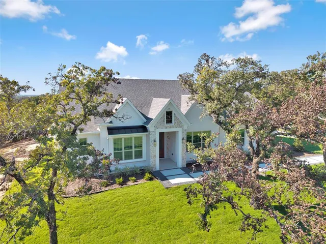 front view of a house with a yard
