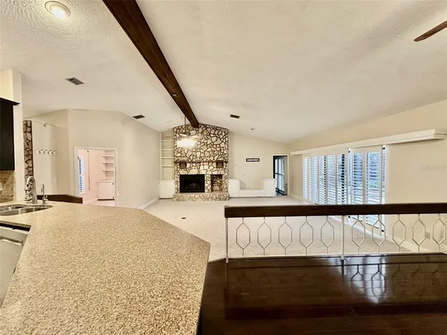 a spacious bedroom with a bed and window