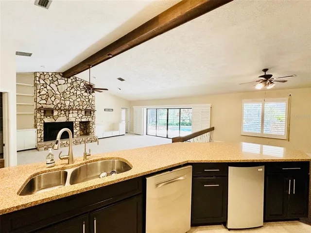 a kitchen with a sink and a window