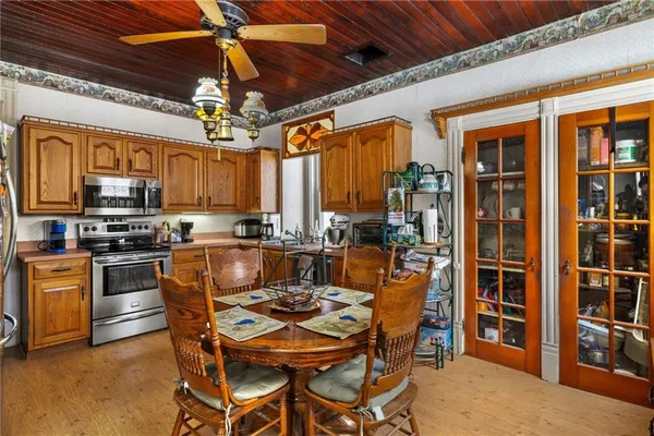 a kitchen with stainless steel appliances granite countertop a stove and cabinets