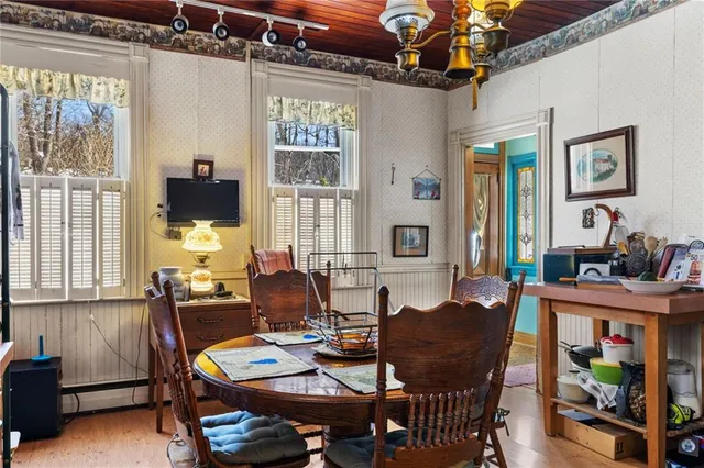 a view of an entryway with a lot of stuff and hardwood floor