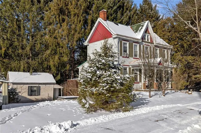 a view of house with yard