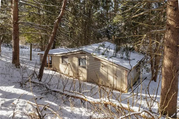 a view of a patio with table and chairs and potted plants