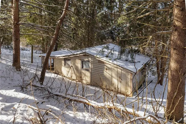 a view of a patio with table and chairs and potted plants