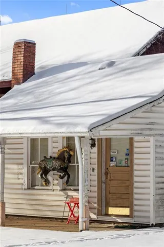 a view of a house with a street