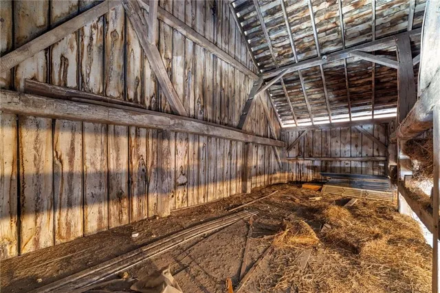 a front view of a house with a yard and ocean view