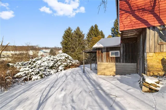 a view of a house with a snow