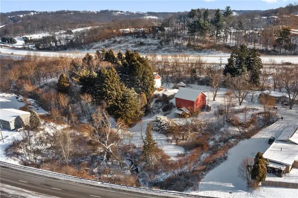 a view of a house with a snow in the yard