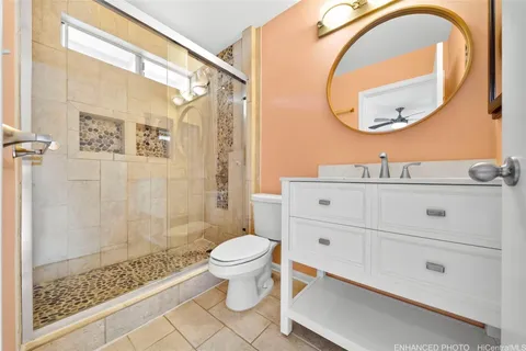 a bathroom with a sink a toilet and a mirror