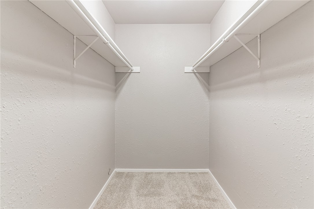 3627 Menchaca Road, Unit 112 Austin, TX 78704 - Photo 17 of 25 Nice size walk in closet has room to hang a lot of clothes plus lots of room on the shelves above the clothes rods.