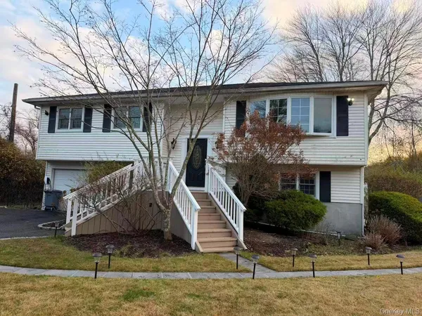 a front view of a house with garage