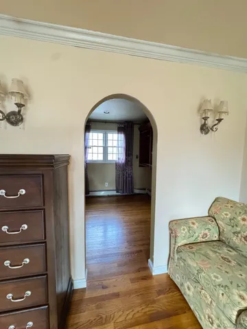 a view of livingroom with furniture and mirror