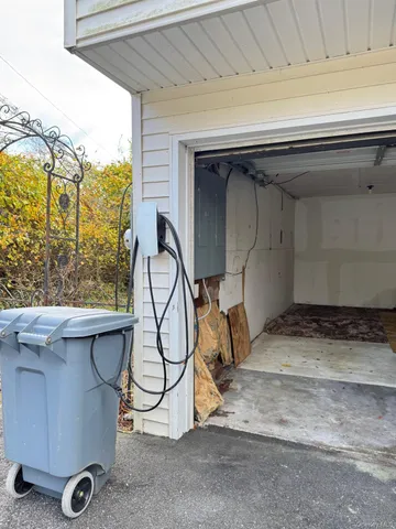 a view of a wooden deck and a yard with swimming pool