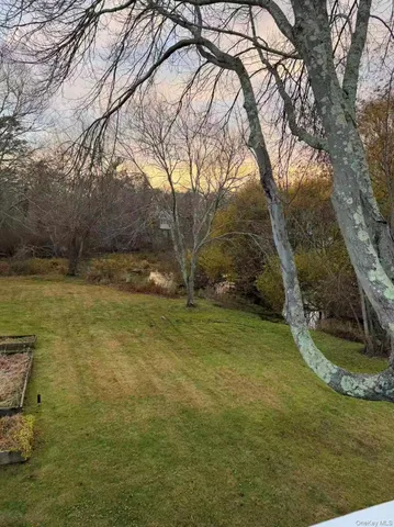 a view of a lake with houses in the back