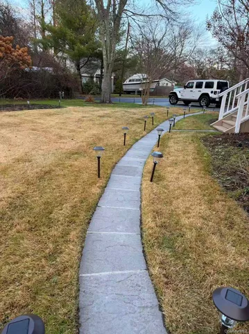 a view of a house with roof deck front of house