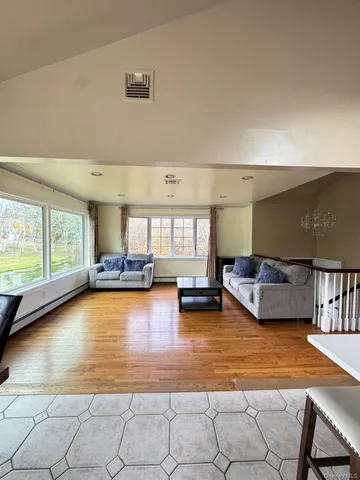 a view of a swimming pool and lounge chair