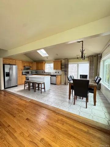 a room with lots of furniture and a large window