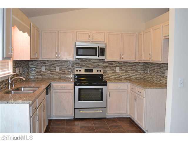 2787 WaterStone Loop High Point, NC 27265 - Photo 6 of 16 Kitchen. Completely updated kitchen with granite countertops and stainless steel appliances.