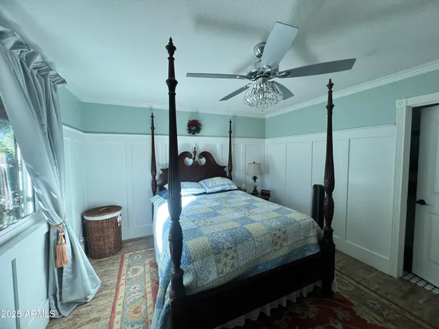 a bedroom with a bed a window and walk in closet