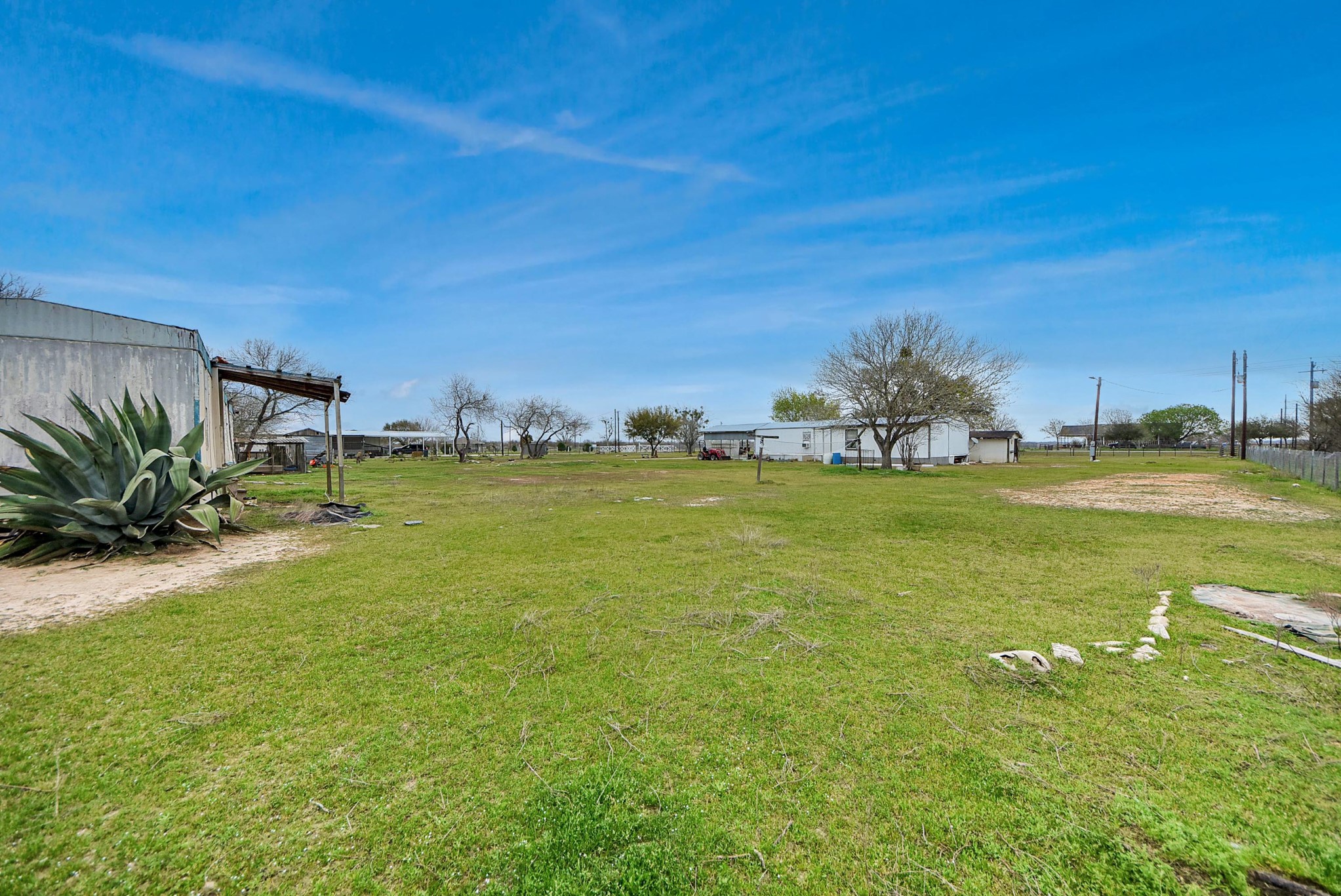 10571 Kerr Road Hempstead, TX 77445 - Photo 9 of 20 a view of a lake with lawn chairs