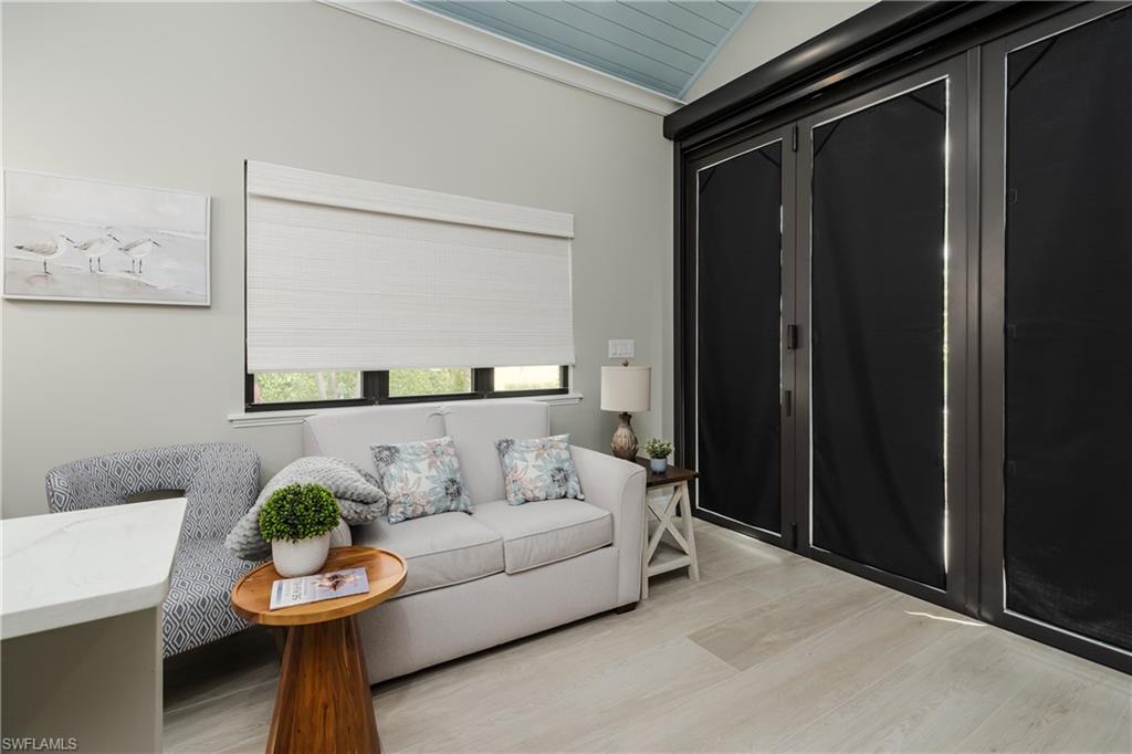 13613 Snapper Lane Naples, FL 34114 - Photo 11 of 49 a living room with furniture and a window