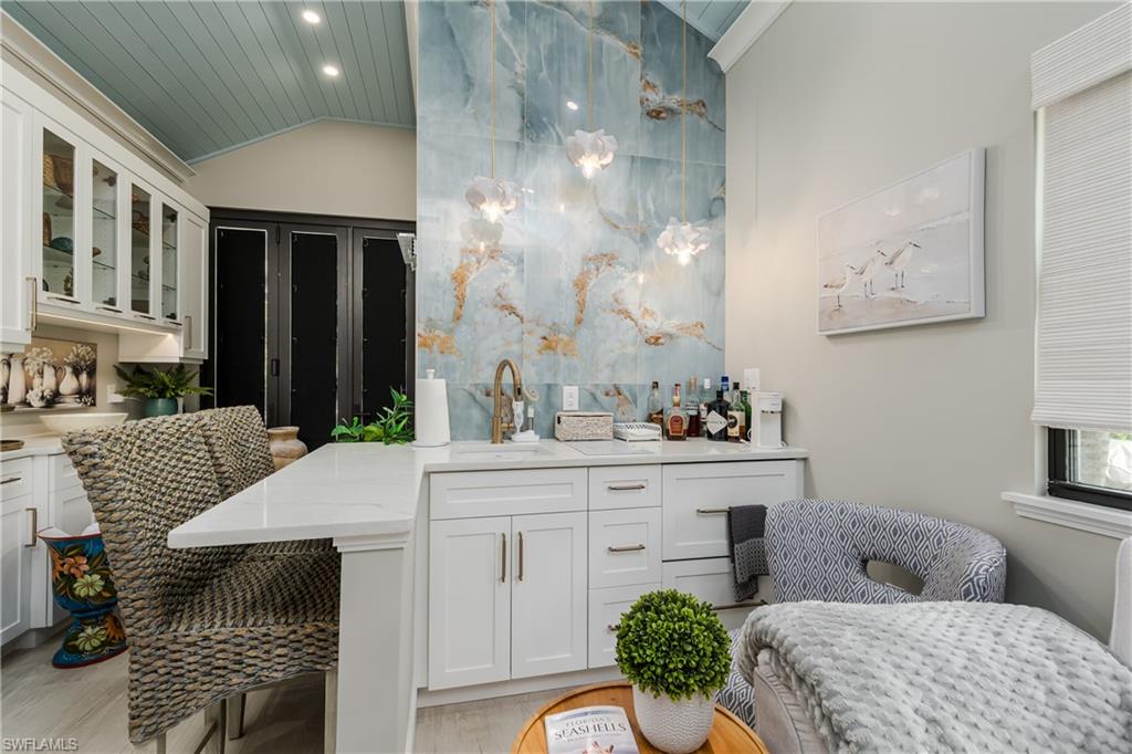 13613 Snapper Lane Naples, FL 34114 - Photo 13 of 49 a living room with furniture and a potted plant