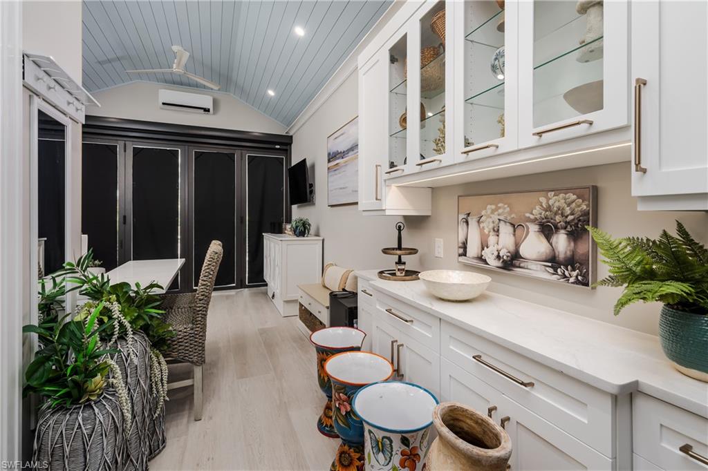 13613 Snapper Lane Naples, FL 34114 - Photo 14 of 49 a kitchen with sink and stove