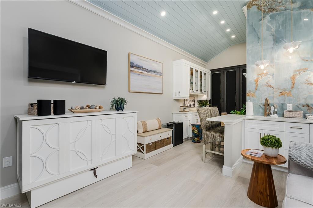 13613 Snapper Lane Naples, FL 34114 - Photo 15 of 49 a living room with furniture and a flat screen tv