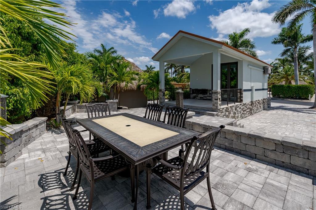 13613 Snapper Lane Naples, FL 34114 - Photo 22 of 49 a view of an outdoor space with patio