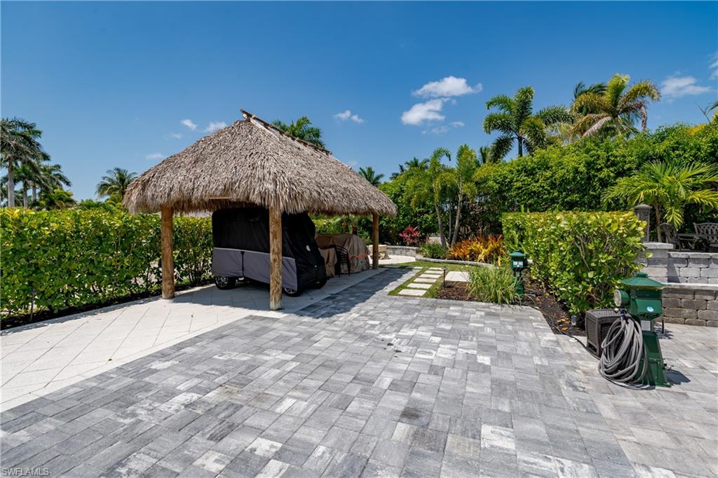13613 Snapper Lane Naples, FL 34114 - Photo 31 of 49 a view of a garden with patio